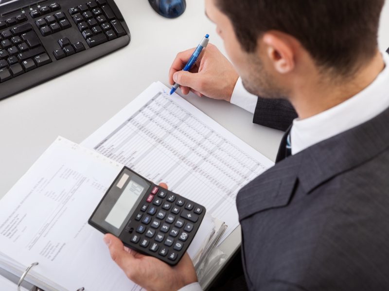 Successful accountant working with financial data in the office