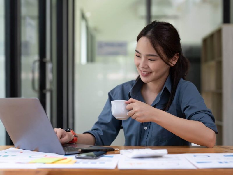 young-woman-using-laptop-while-working-for-business-financial-investment-.jpg